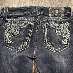 WOMANS MISS ME SKINNY JEANS SIZE 28.  LOTS OF BLING!